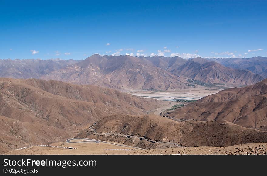 Yellowish mountain road view in tibet of China