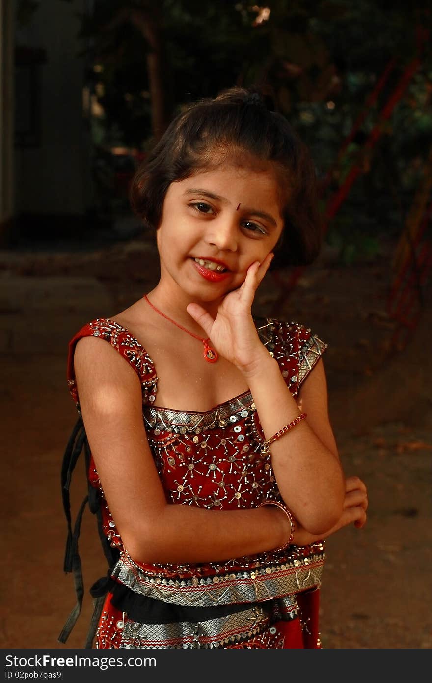 A simple and charming smile of a small Indian girl.