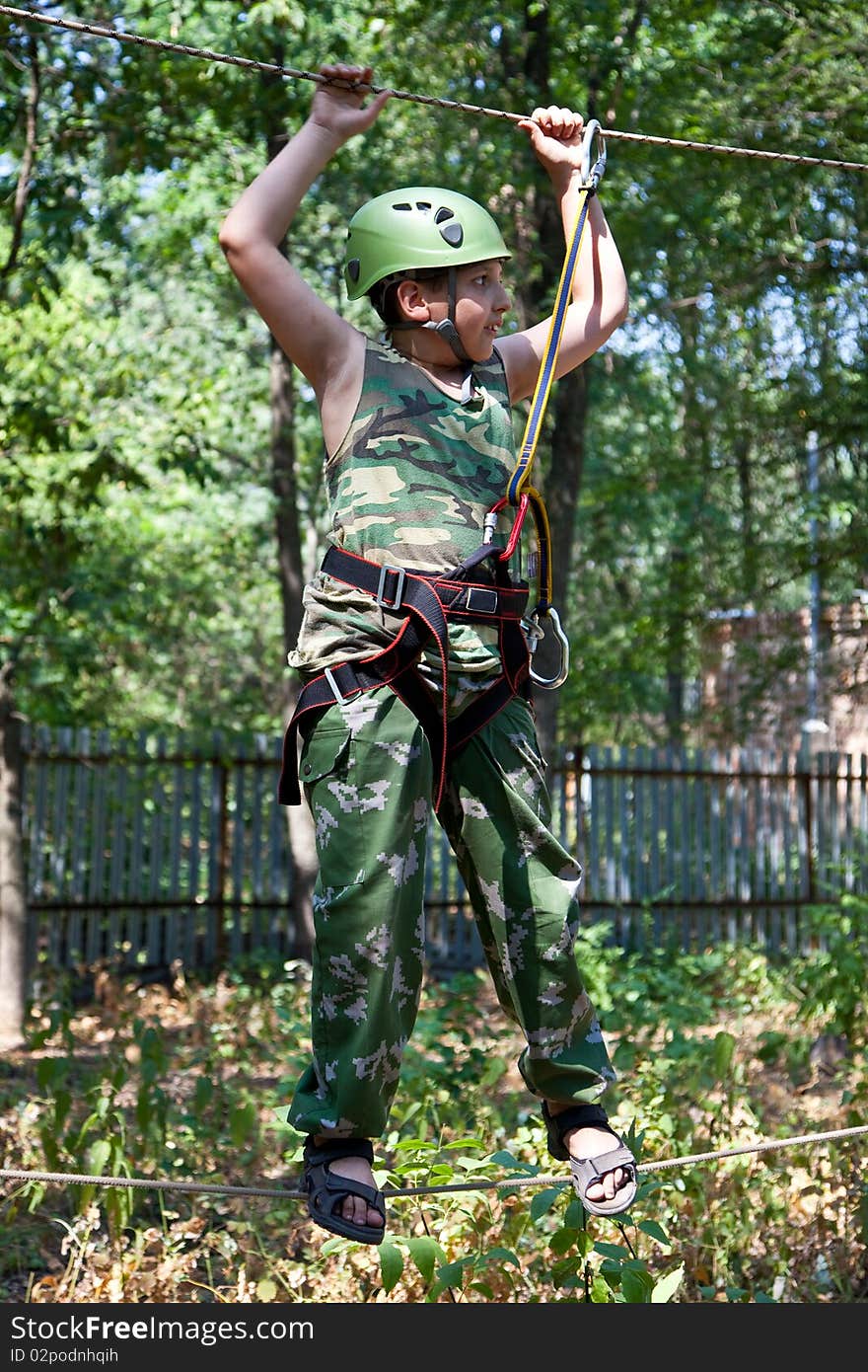 Portrait of  boy wearing helmet and climbing.