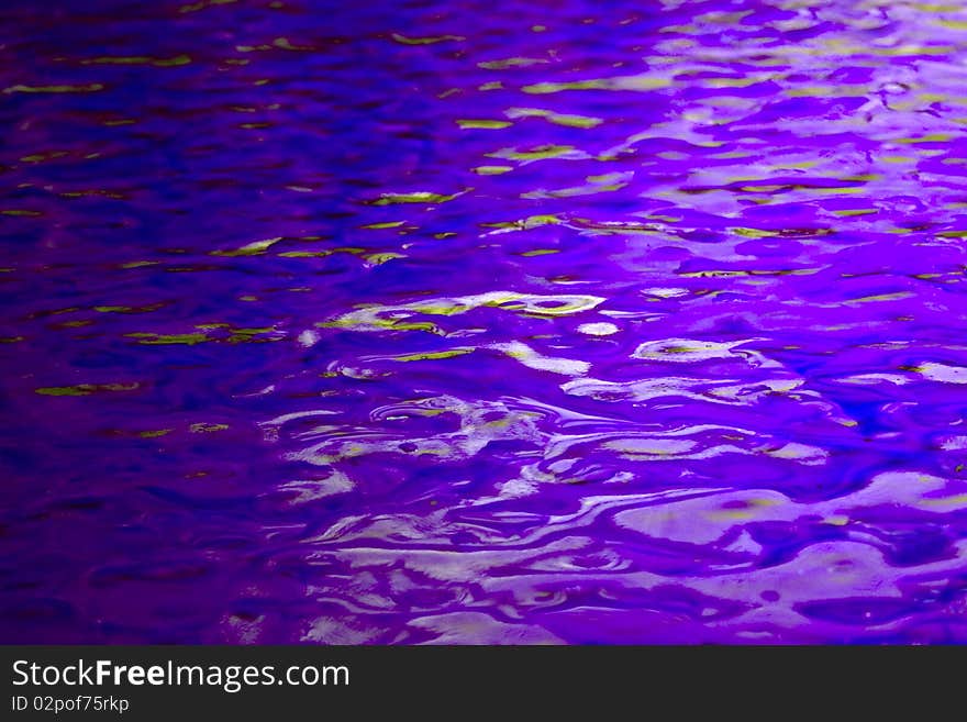 a background of blue textured stained glass with light and dark reflections. a background of blue textured stained glass with light and dark reflections