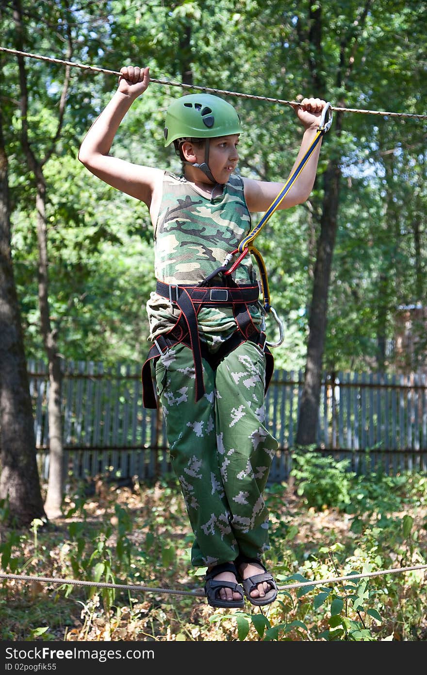 Portrait of  boy wearing helmet and climbing.