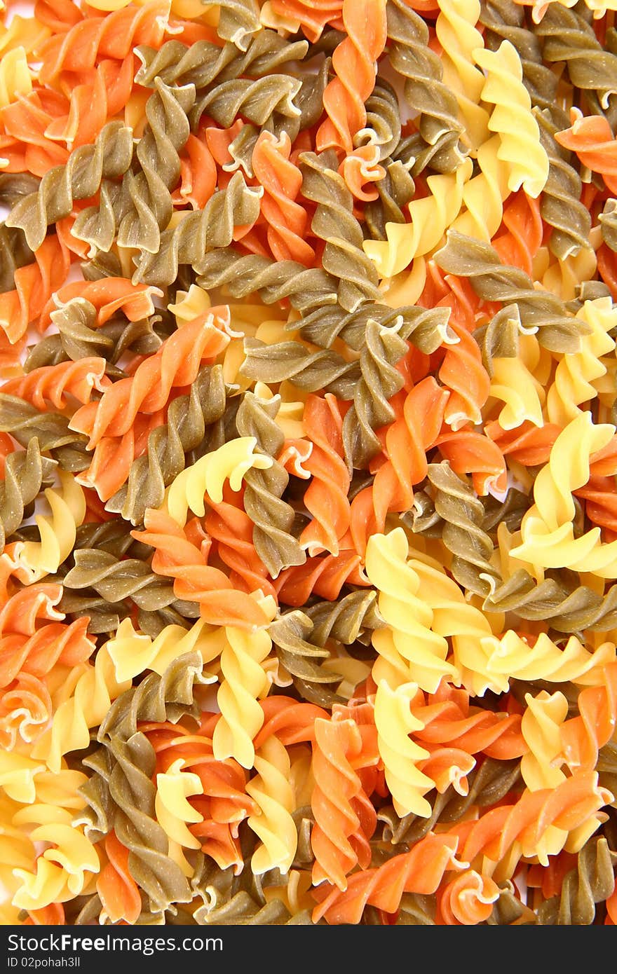 Raw colorful fusilli pasta