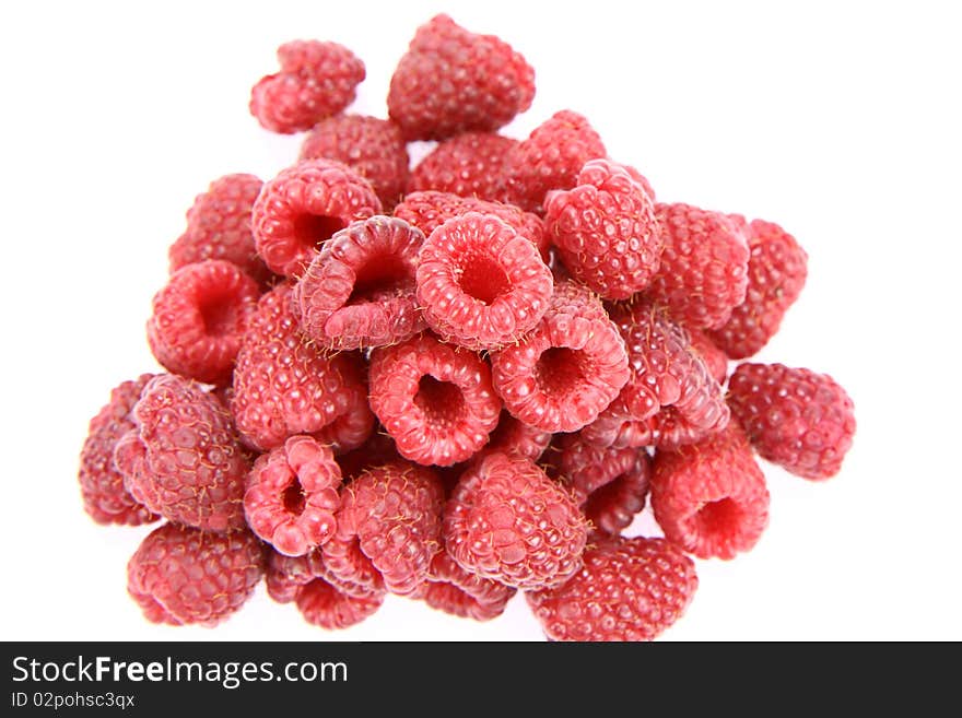 Raspberries: a stack of fruit on white background