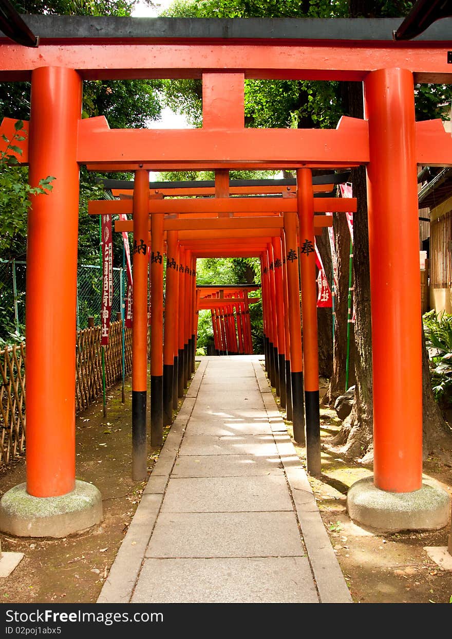 Bright orange arches leading to a temple. Bright orange arches leading to a temple.