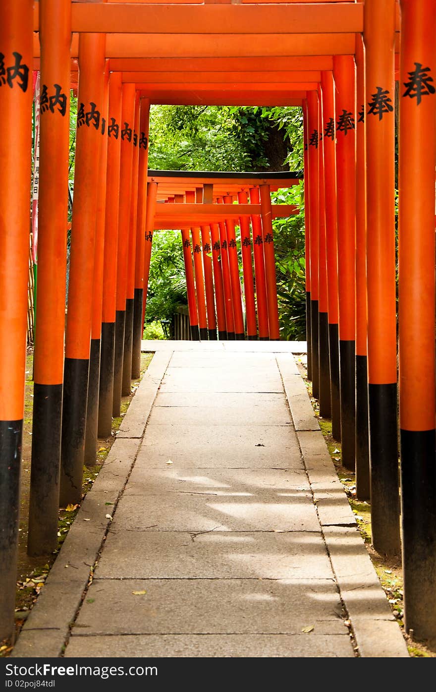 Bright orange arches leading to a temple. Bright orange arches leading to a temple.