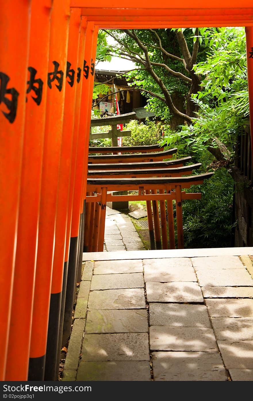 Bright orange arches leading to a temple. Bright orange arches leading to a temple.