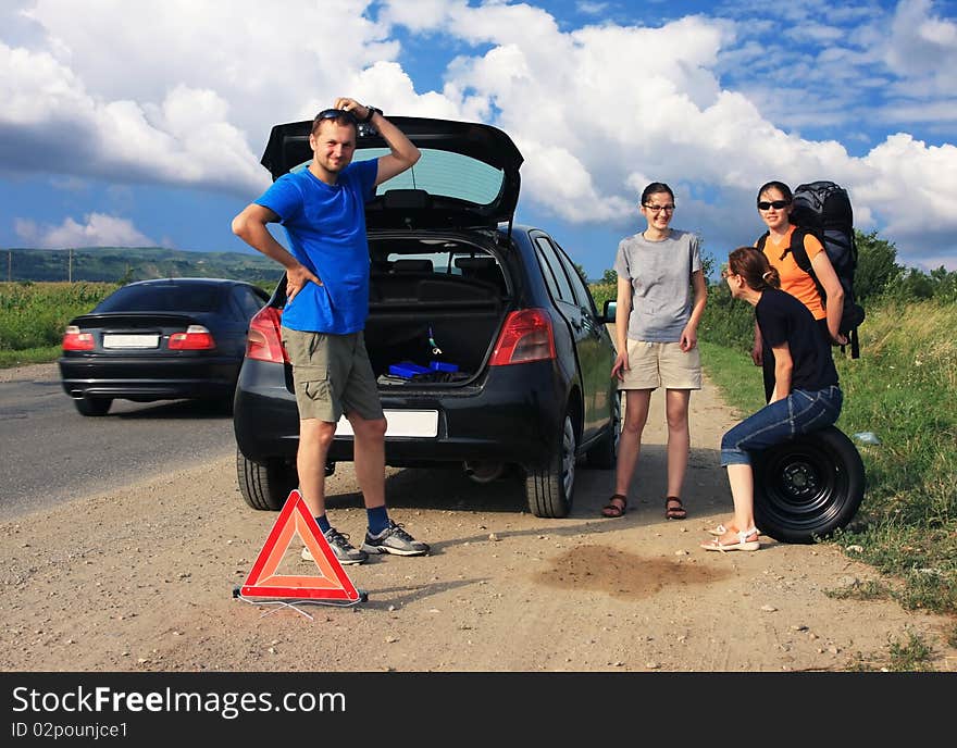 People having a flat tire