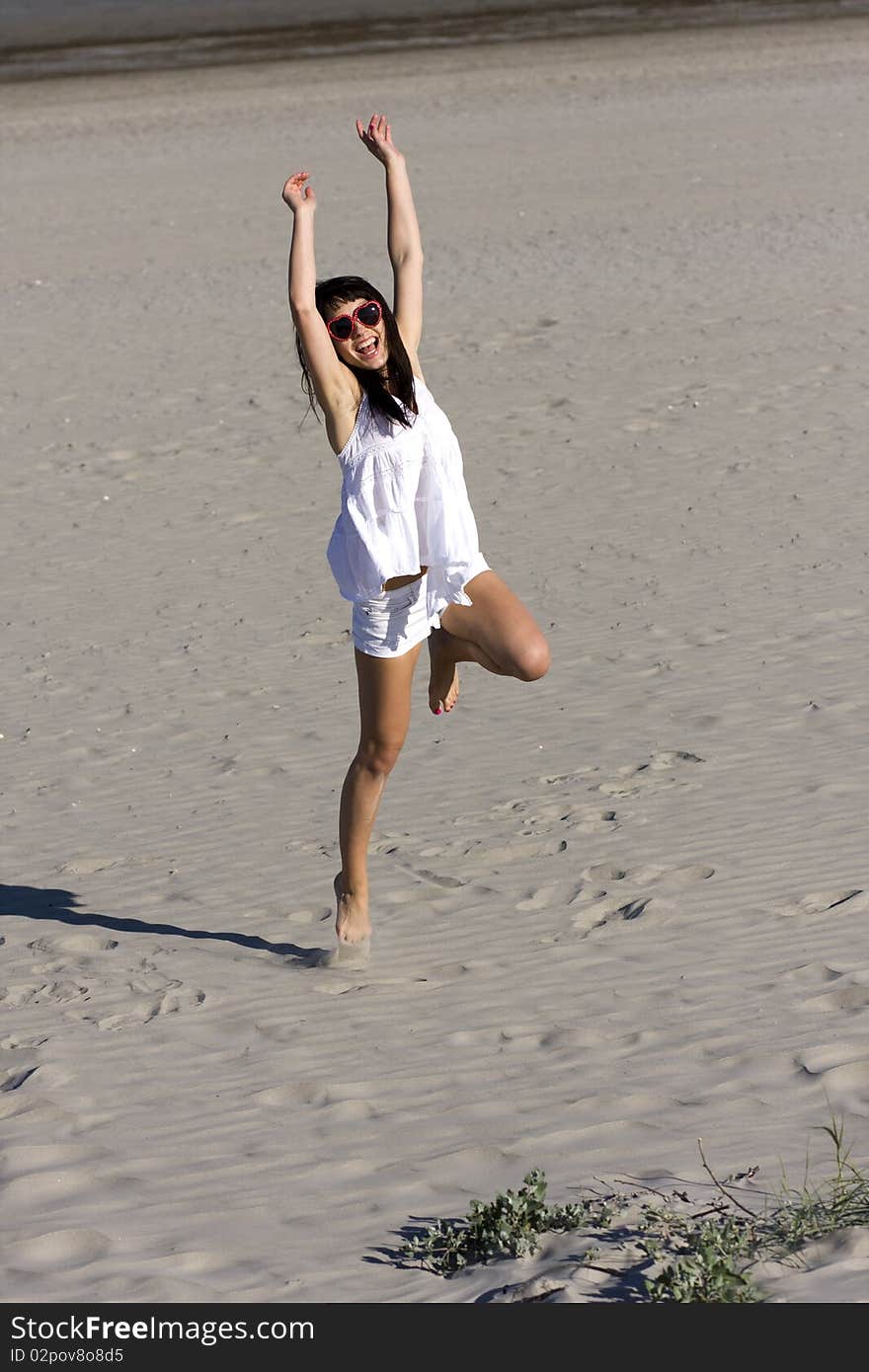 Young Atractive Woman Is Dancing On The Beach