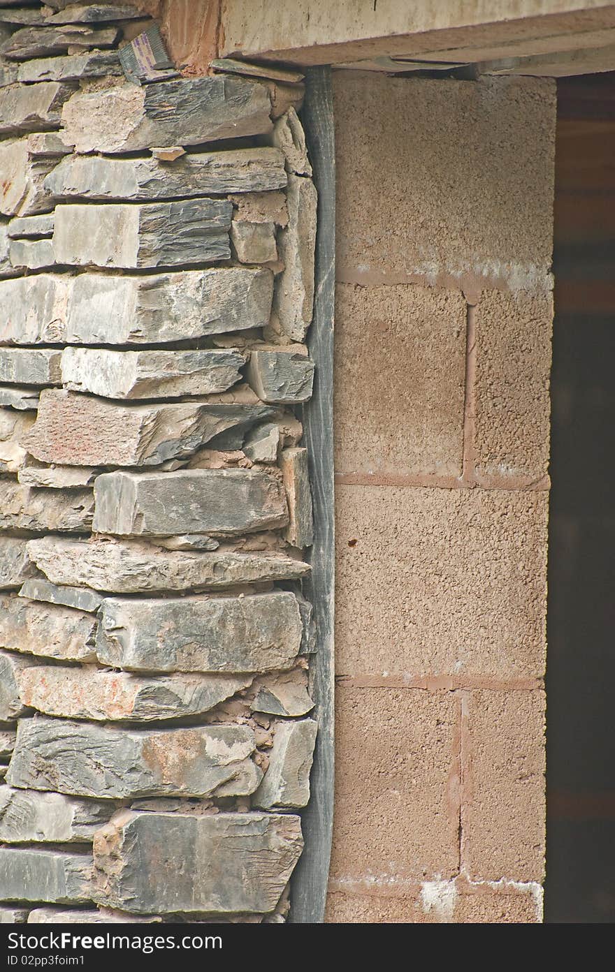 An image showing how the exterior of a modern building designed with dry stone walls requires an inner leaf of concrete blocks to ensure the building is wind and water tight. An image showing how the exterior of a modern building designed with dry stone walls requires an inner leaf of concrete blocks to ensure the building is wind and water tight.