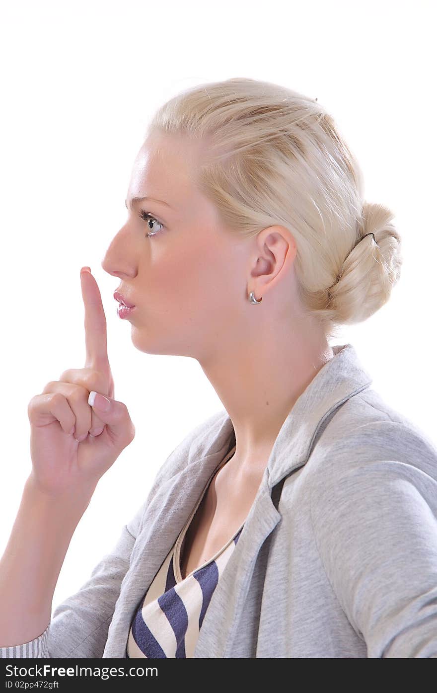 Beauty female with her finger to her mouth gesturing for quiet, isolated on white. Beauty female with her finger to her mouth gesturing for quiet, isolated on white