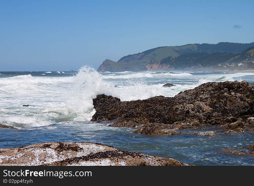 Rocks at low tide in the ocean water, Oregon Coast ocean view water splash. Rocks at low tide in the ocean water, Oregon Coast ocean view water splash