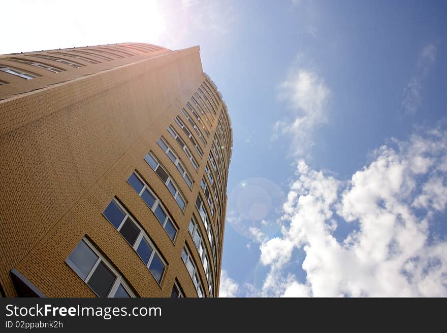 High-rise apartment building on a background of blue sky