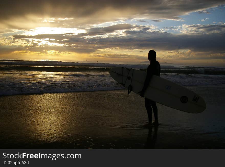 Surfer Watching the Sunset