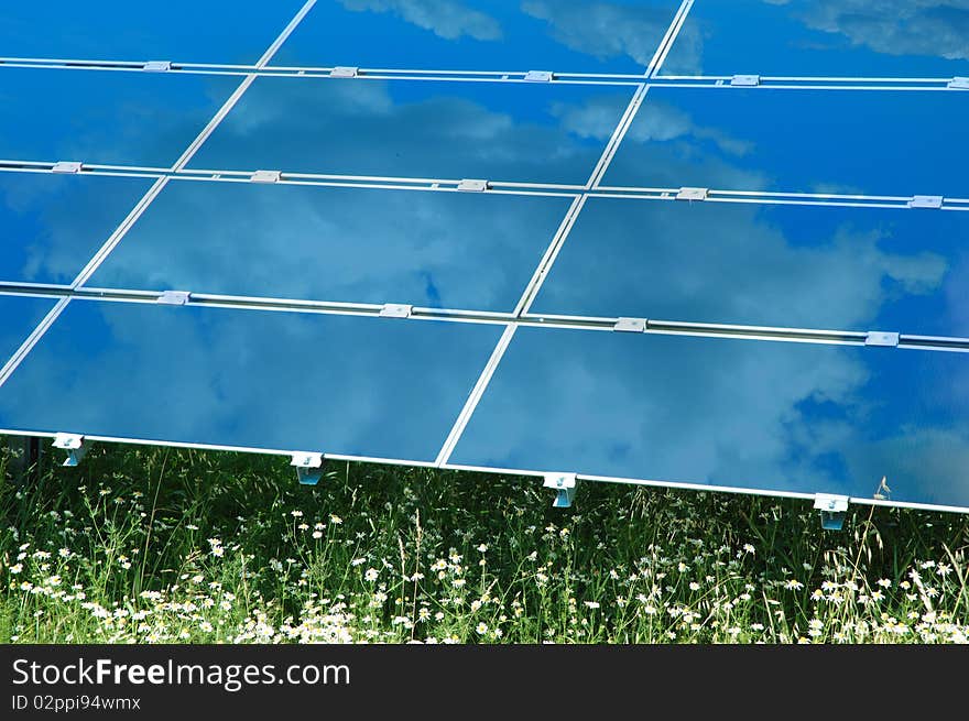 Solar power plant below blue sky. Solar power plant below blue sky