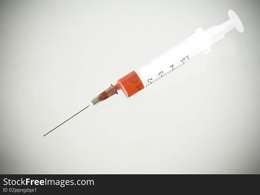 Photo of Medical Syringe vignetted background