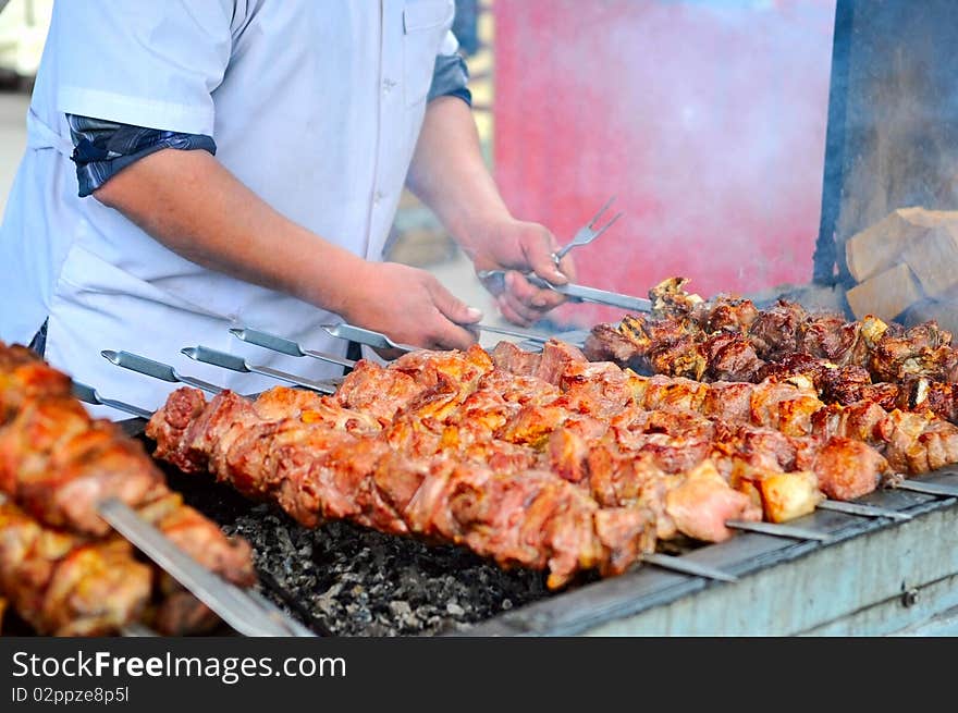 The image of shashlik cooking on barbecue