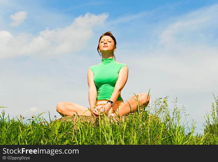 Young woman in meditation pose. Young woman in meditation pose