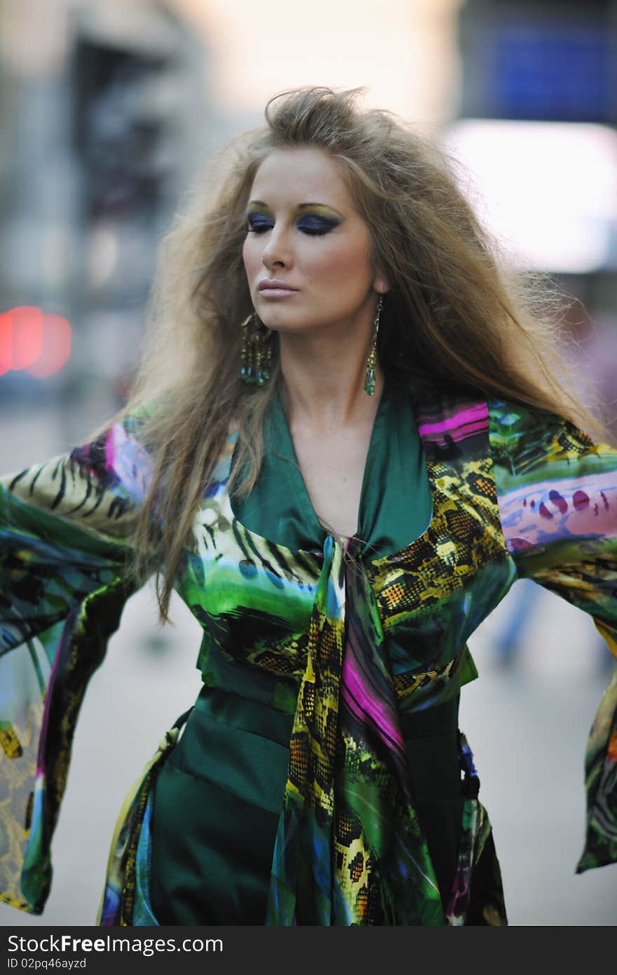 Elegant Woman On City Street At Night