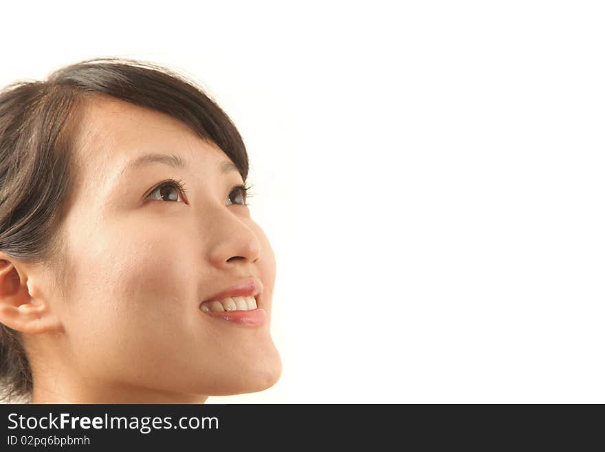 Portrait of young beautiful woman looking up