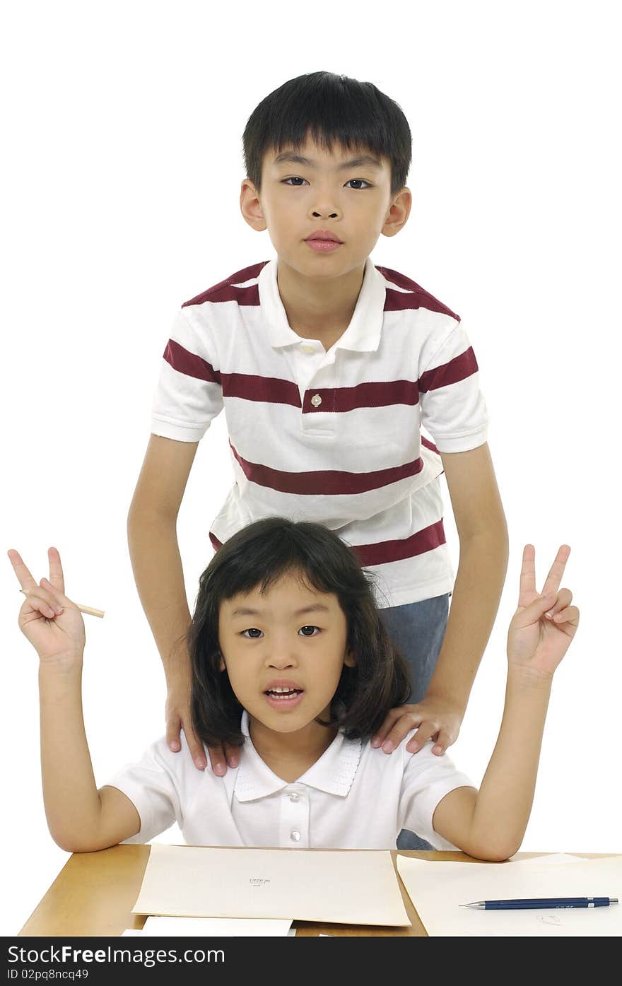 Cute children are playing and posing in studio