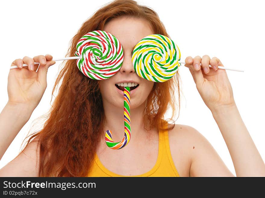 Young woman with lollypop on white