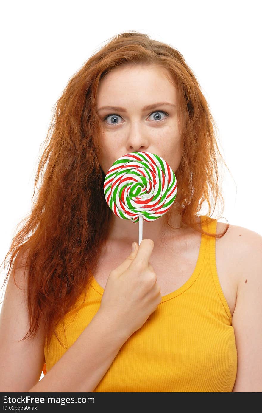 Young woman with lollypop on white