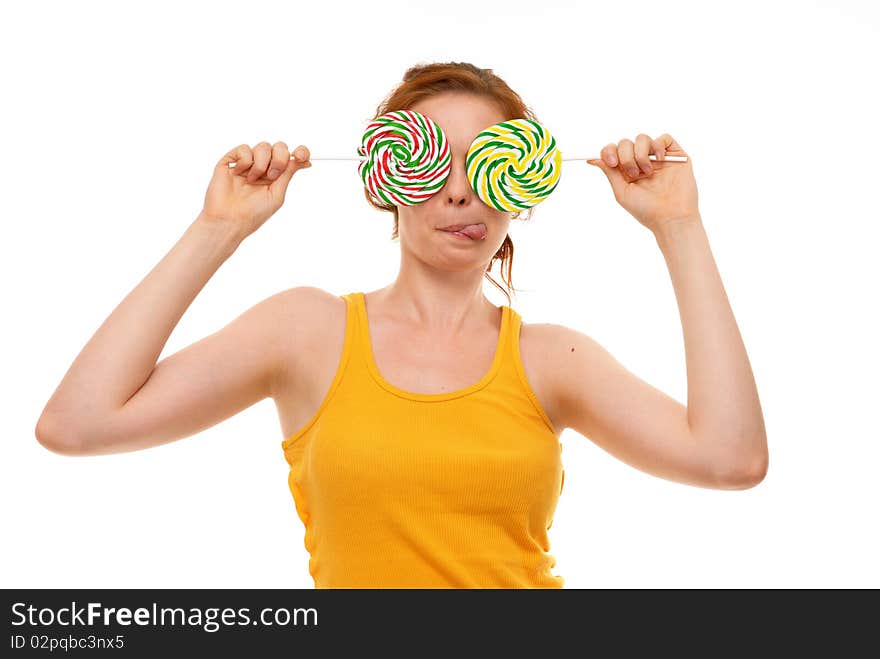 Young woman with lollypop on white