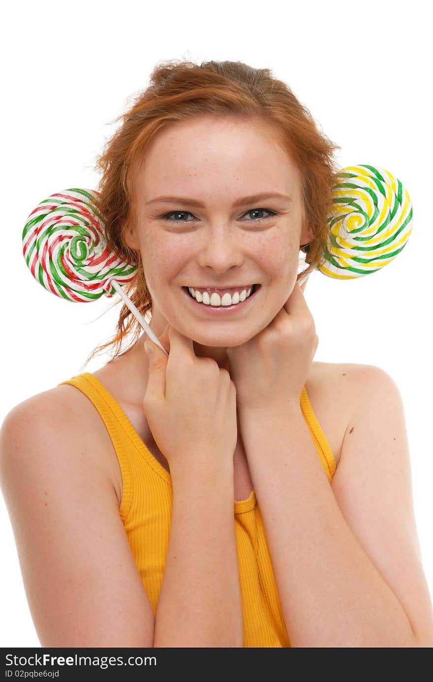 Young woman with lollypop on white