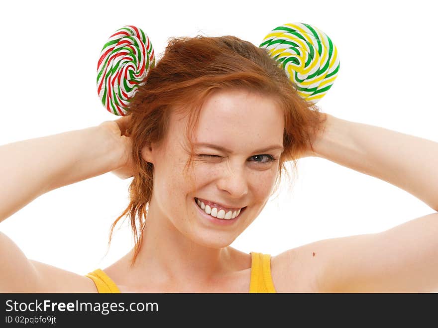 Young woman with lollypop on white