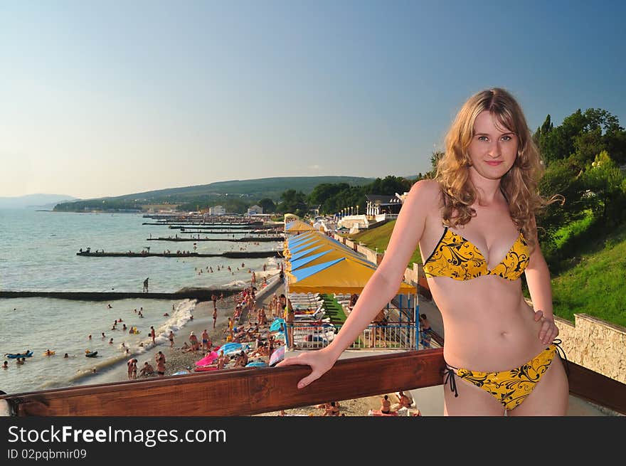 The beautiful girl against the Black Sea beach. Divnomorsky. The beautiful girl against the Black Sea beach. Divnomorsky