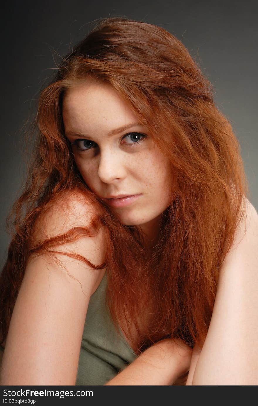 Redhead girl poses in the studio. Redhead girl poses in the studio