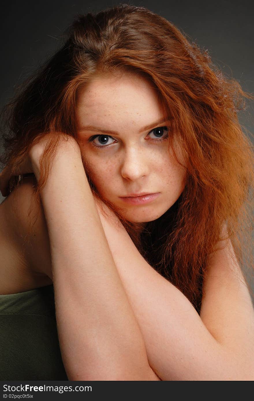 Redhead girl poses in the studio. Redhead girl poses in the studio