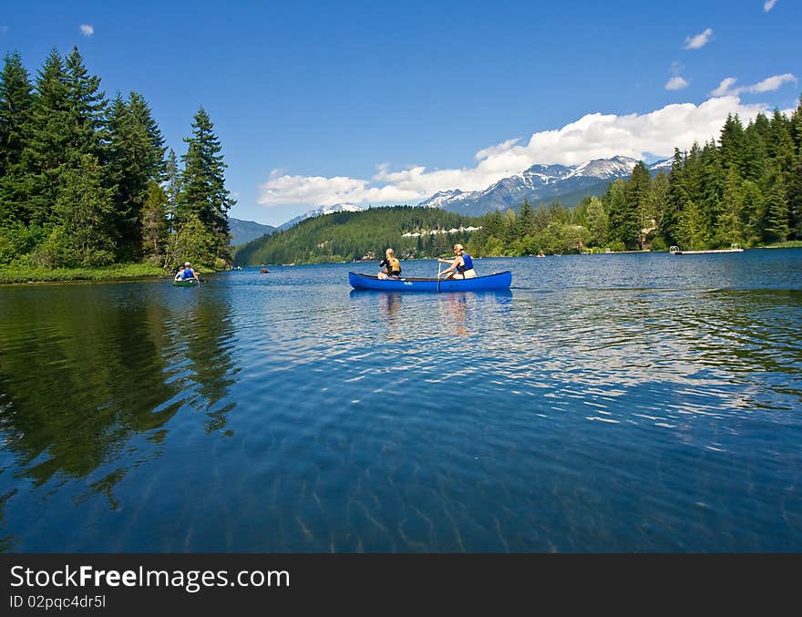 Exploration of the lake via canoes on a beautiful summer day. Exploration of the lake via canoes on a beautiful summer day