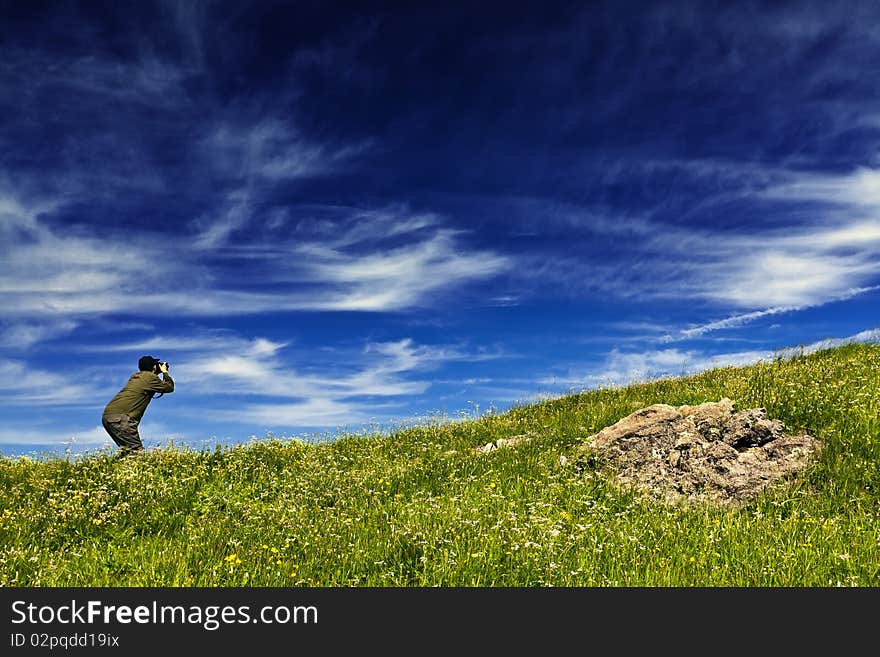 A cameraman standed and shot in the peak. A cameraman standed and shot in the peak.