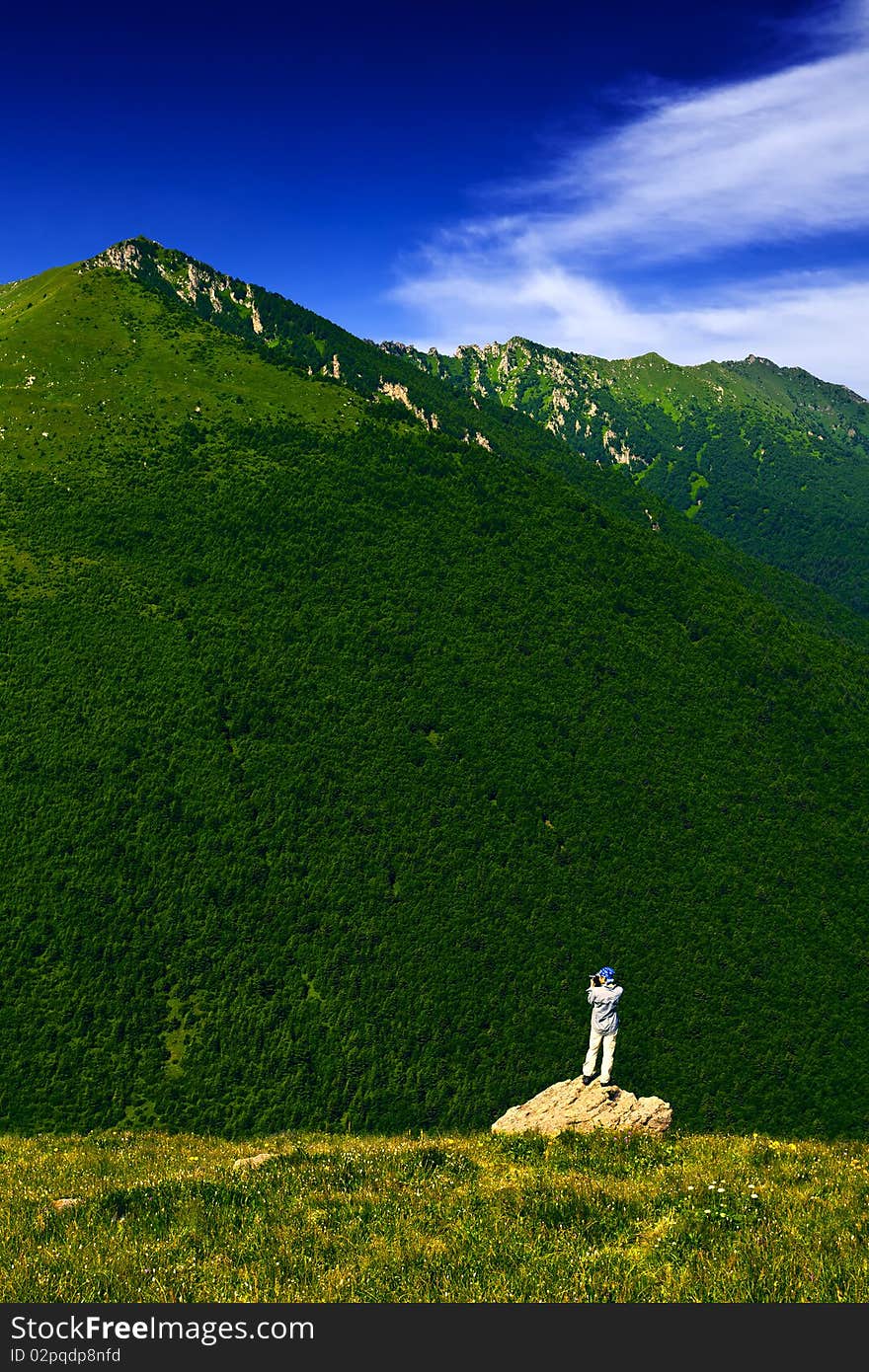 A cameraman standed and shot in the peak. A cameraman standed and shot in the peak.