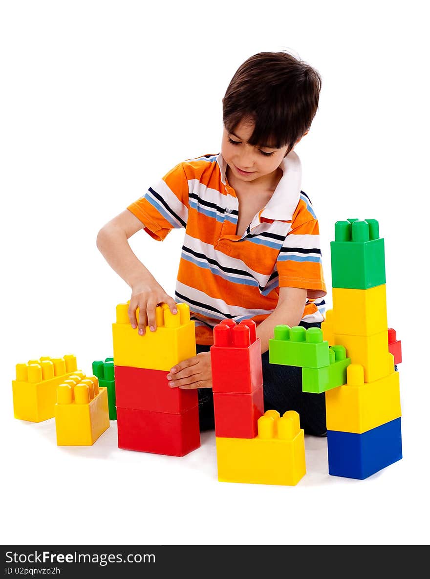 Cute little boy playing on white isolated background