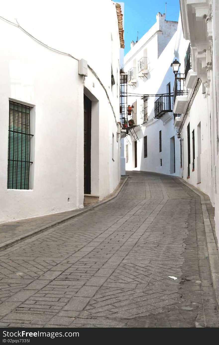 This is a typical street of Vejer de la Frontera, so called, white village, in Andalusia, the south of Spain. This is a typical street of Vejer de la Frontera, so called, white village, in Andalusia, the south of Spain.