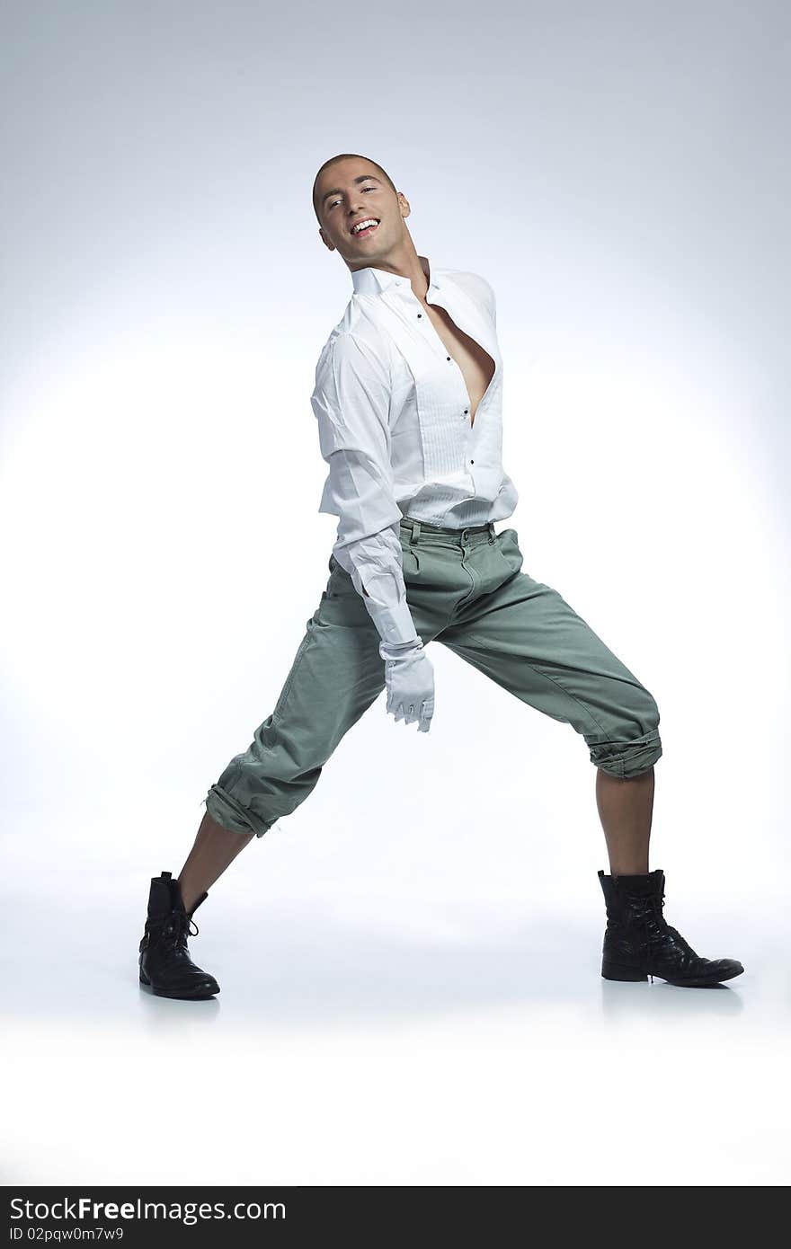 Male dancer in white shirt wearing white gloves. Male dancer in white shirt wearing white gloves