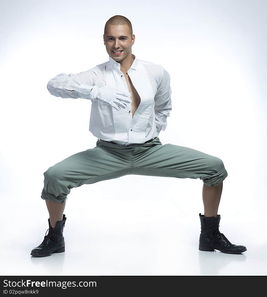 Male dancer in white shirt wearing white gloves. Male dancer in white shirt wearing white gloves