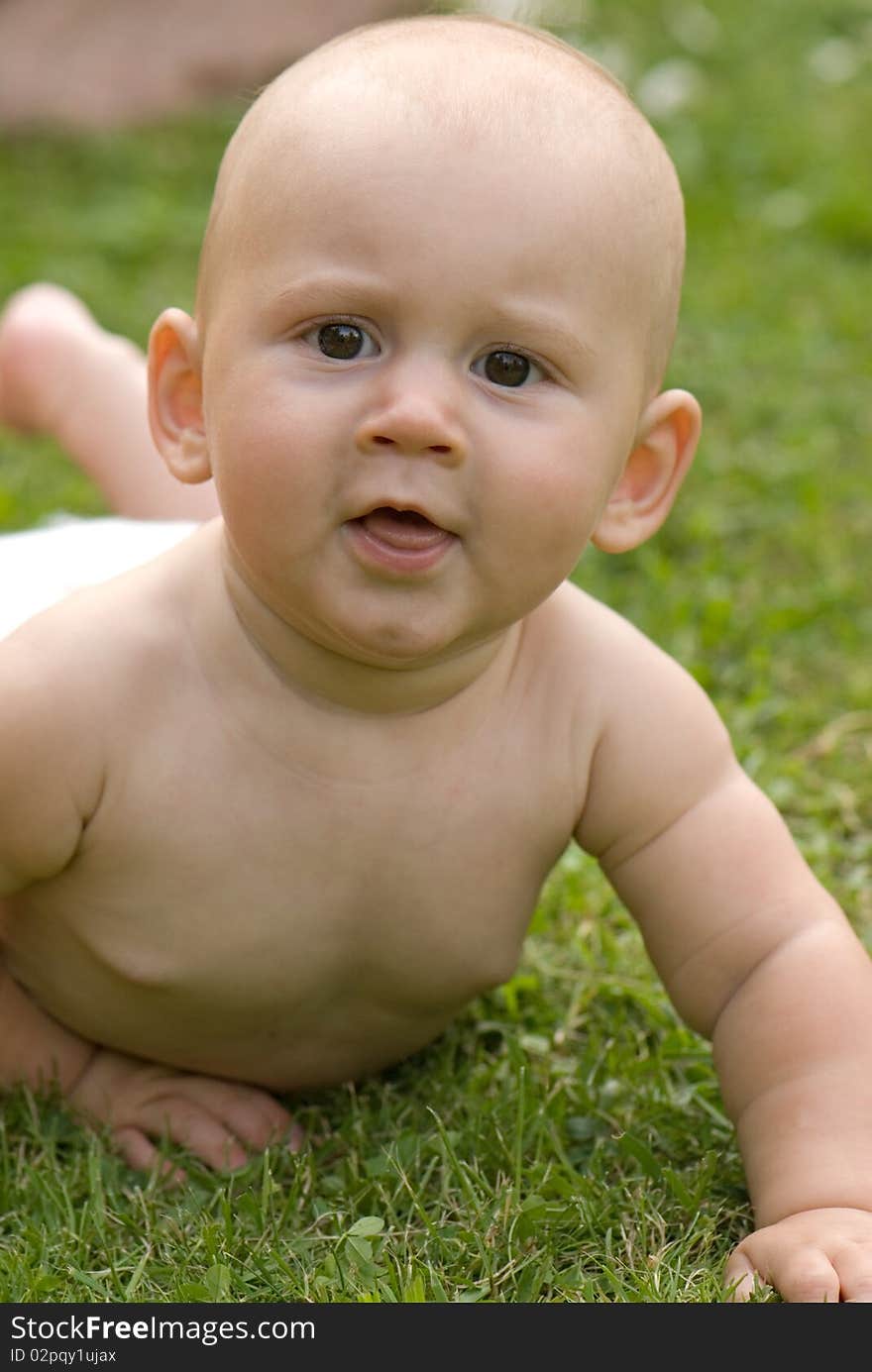 Baby lying on the grass