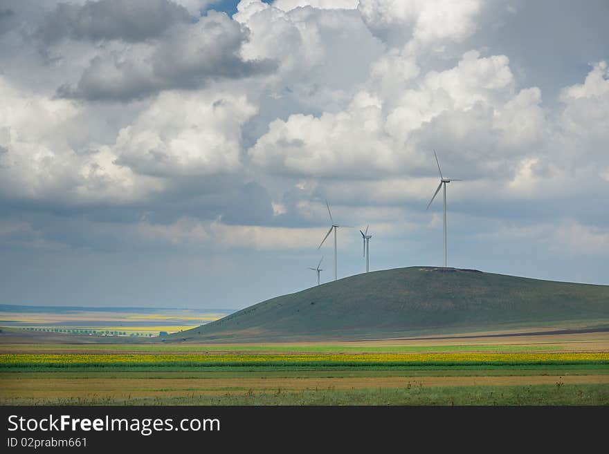 Eolian field with blue sky and clouds. Eolian field with blue sky and clouds