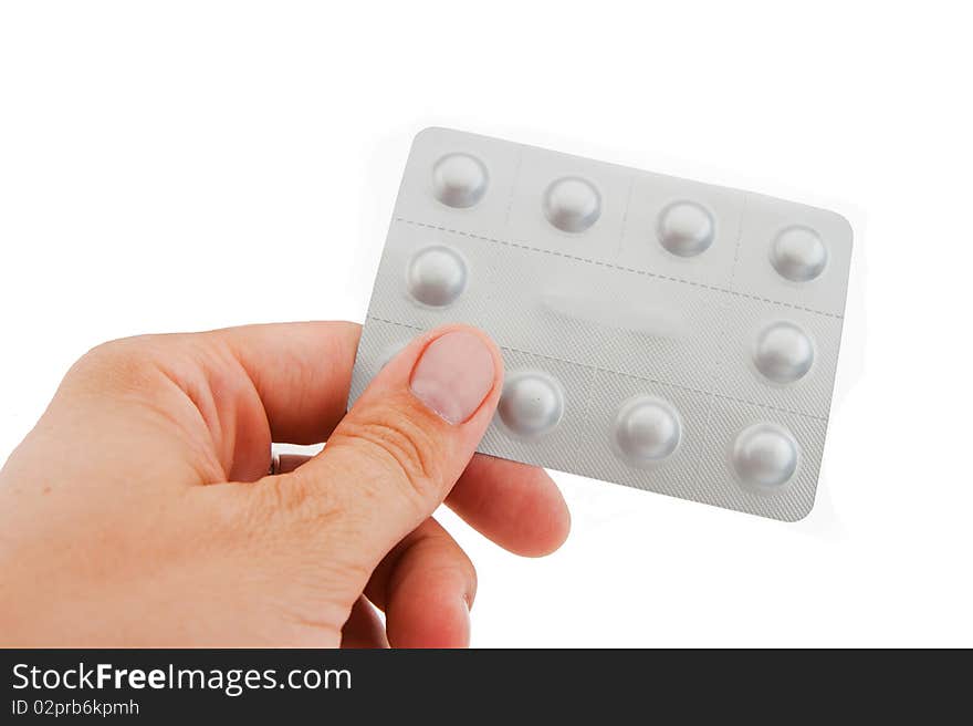 Human hand and packing the tablets on white background