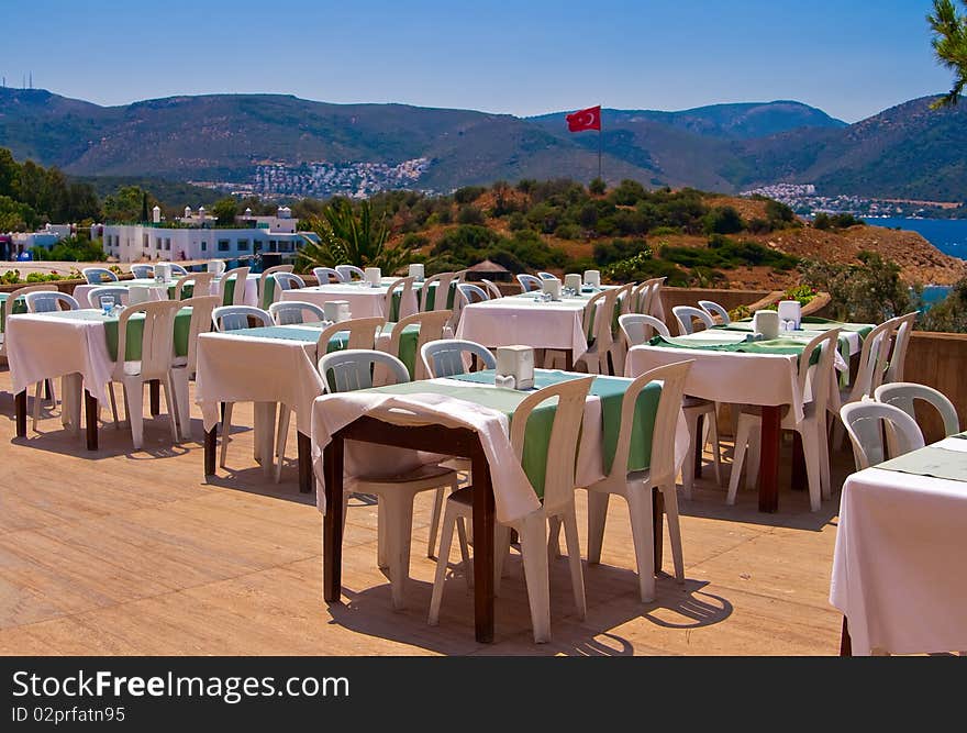 Outdoor restaurant near the beach awaiting diners