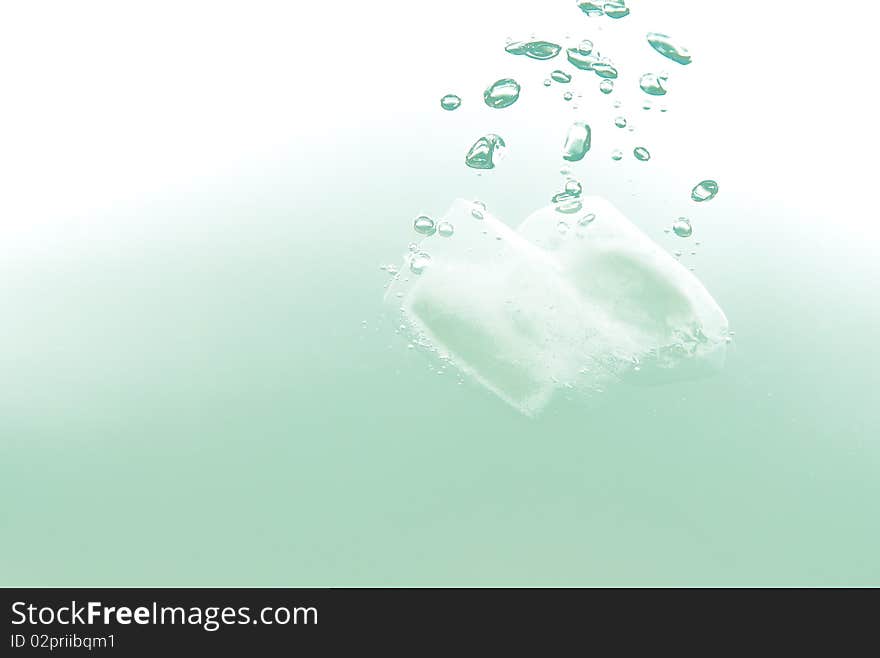 An ice cube splashing in water. An ice cube splashing in water