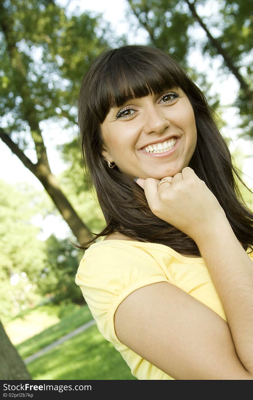 Young woman pensive outdoors in the park. Young woman pensive outdoors in the park