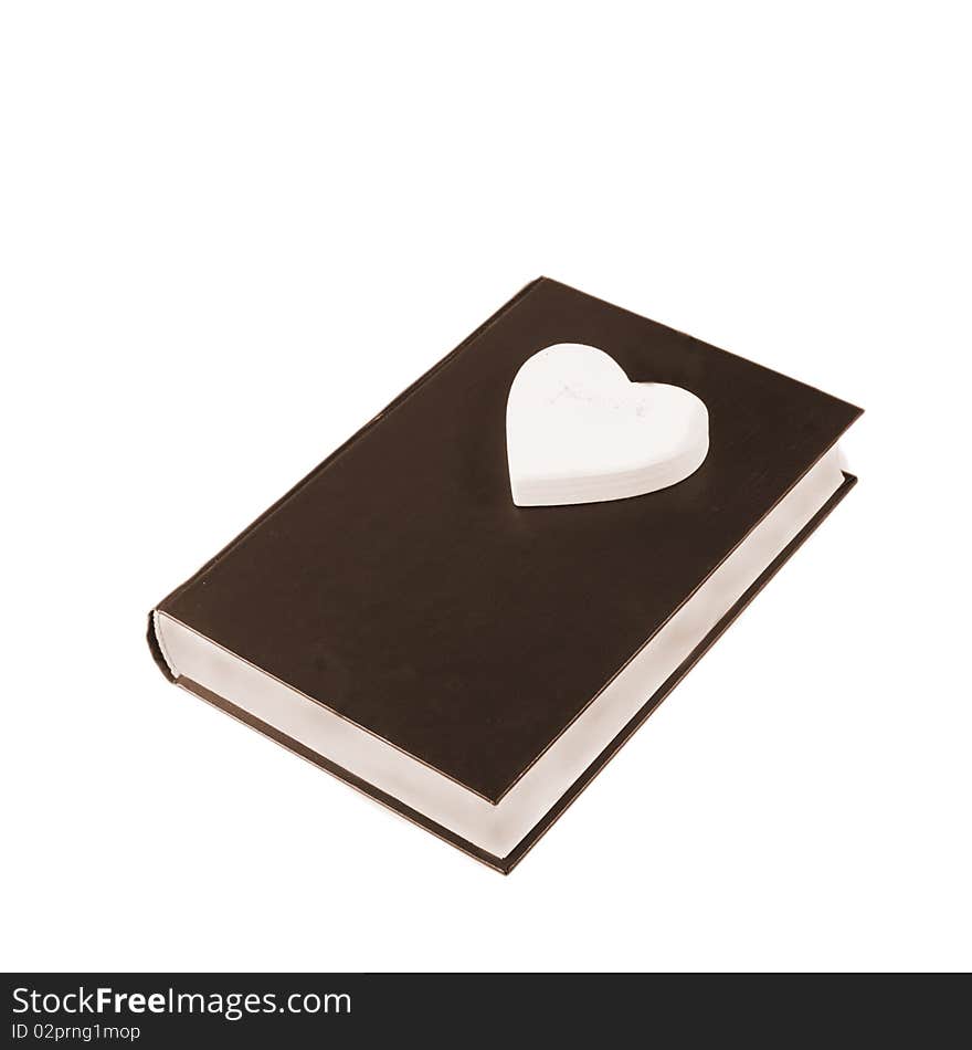 A single book with heart on white