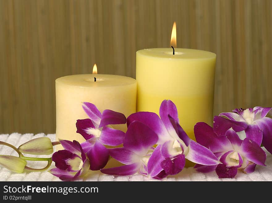 Aromatherapy candles and pink orchid. Aromatherapy candles and pink orchid