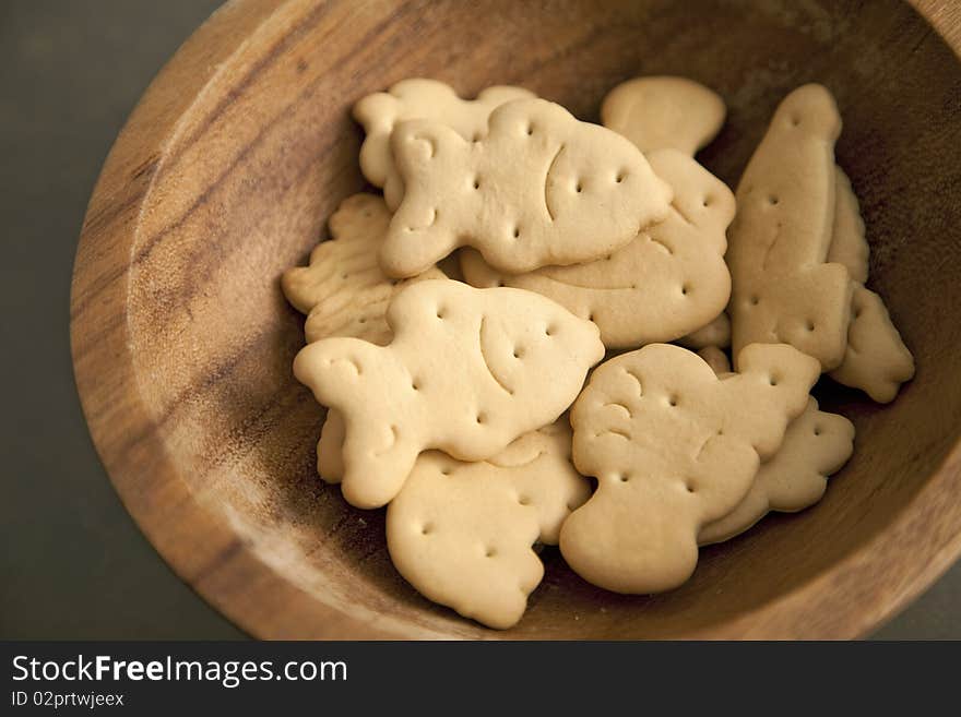 Handful of animal shaped biscuits in a plate