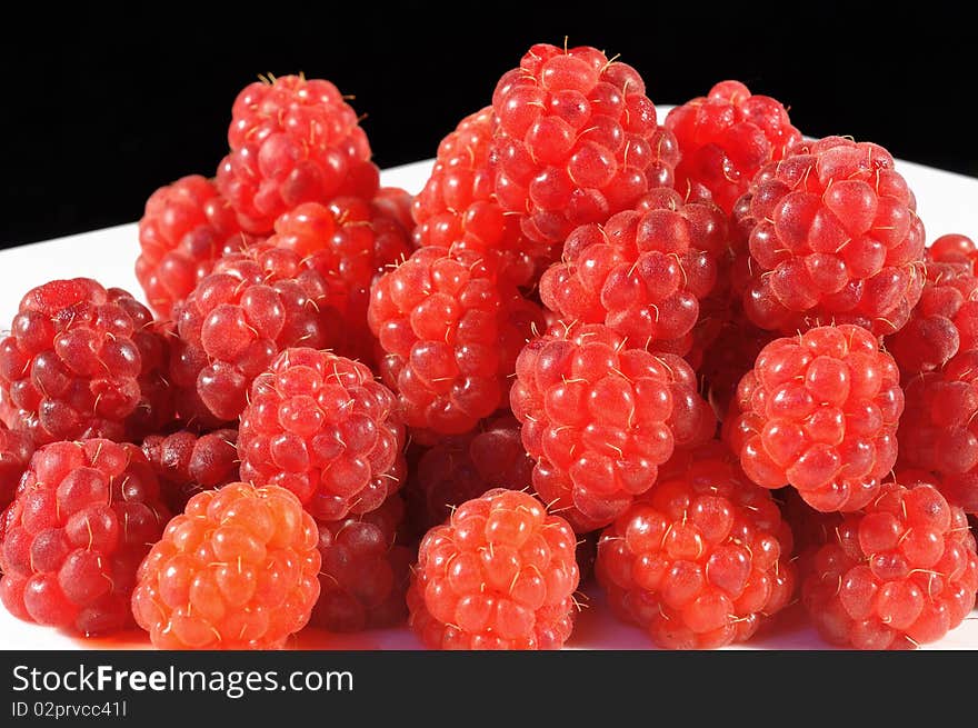 A lot of fresh red raspberries