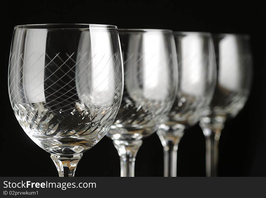 Empty wine glass on black background